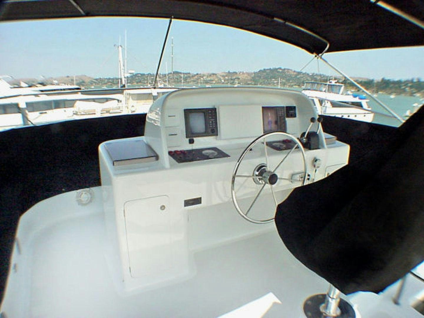 a person driving a boat aboard O'NEILL Yacht for Sale