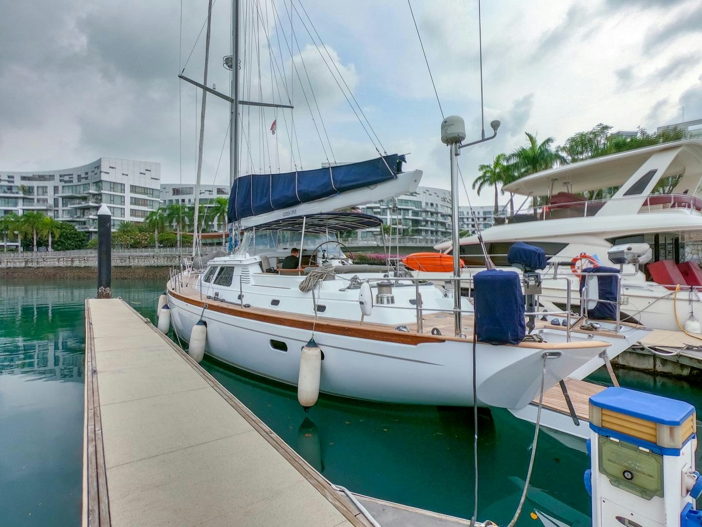 a boat docked at a pier aboard GOLDEN OPUS Yacht for Sale