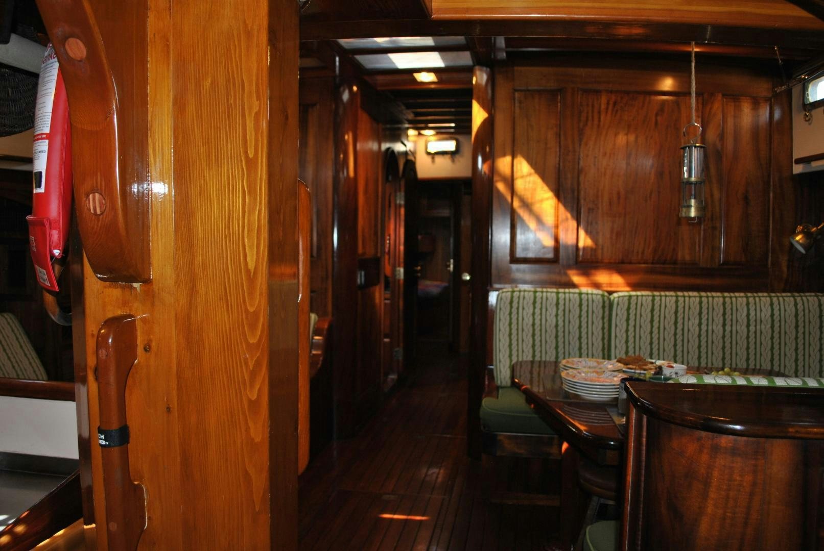 a room with tables and chairs aboard TREE OF LIFE Yacht for Sale