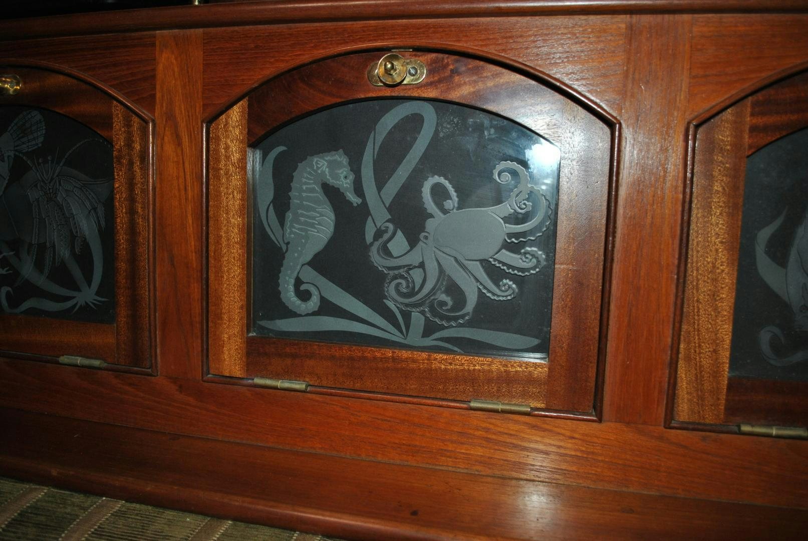 a wood framed picture of a couple of people aboard TREE OF LIFE Yacht for Sale