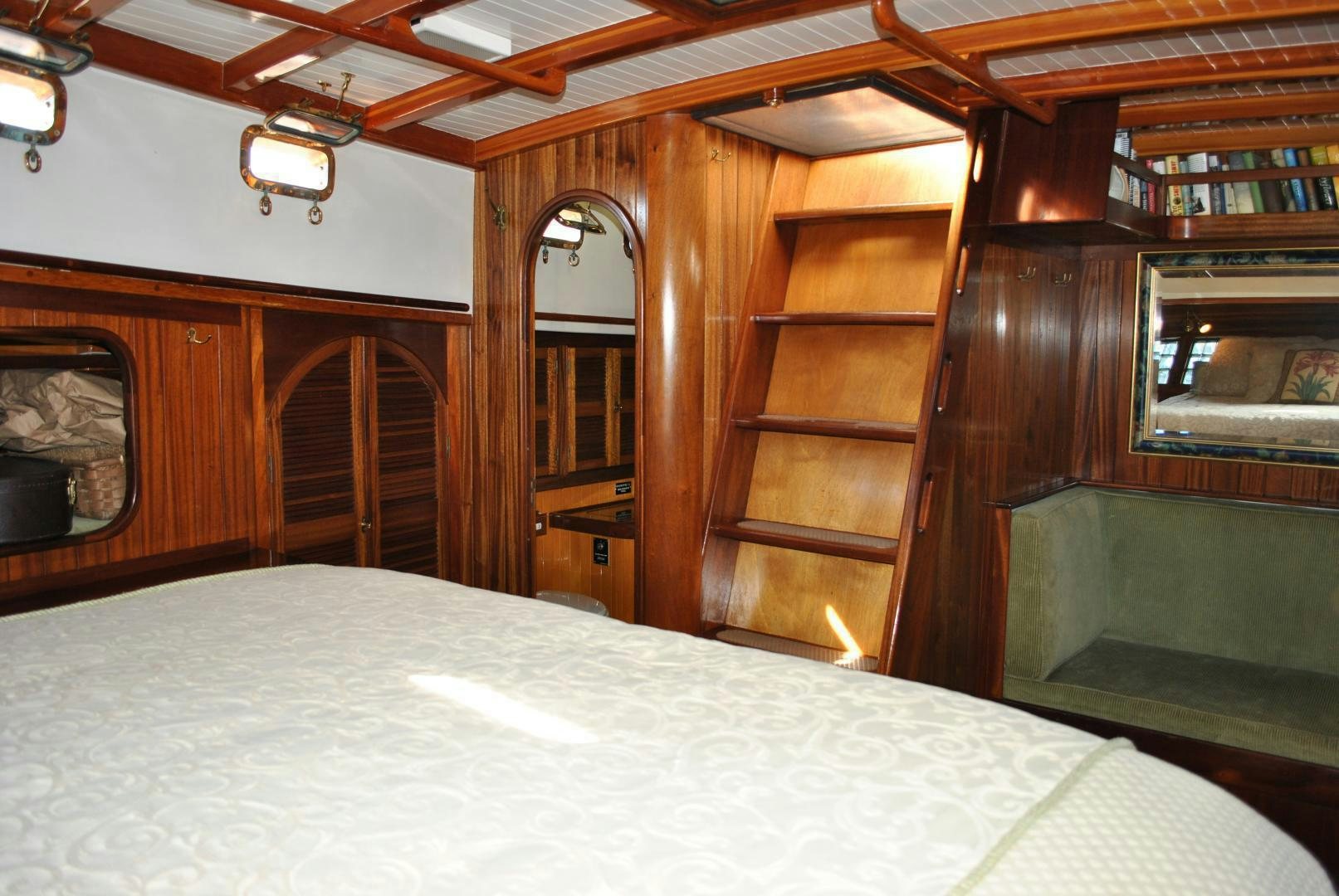 a bed in a room aboard TREE OF LIFE Yacht for Sale