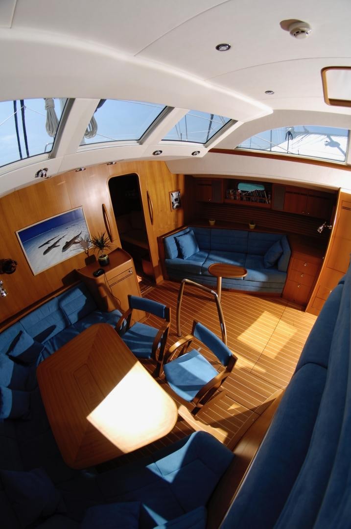 a room with a couch and chairs aboard PULSAR II Yacht for Sale