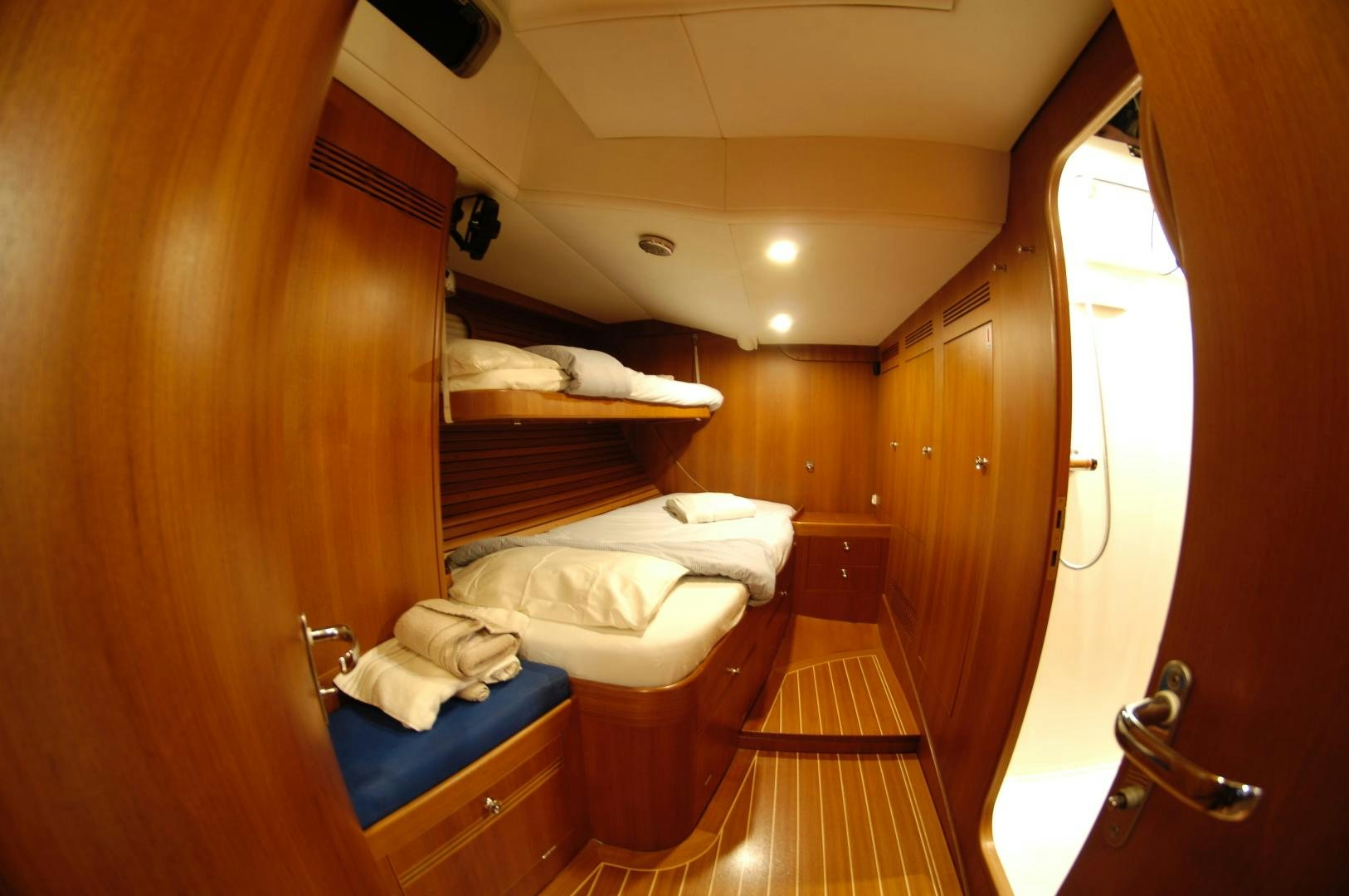 a room with bunk beds aboard PULSAR II Yacht for Sale