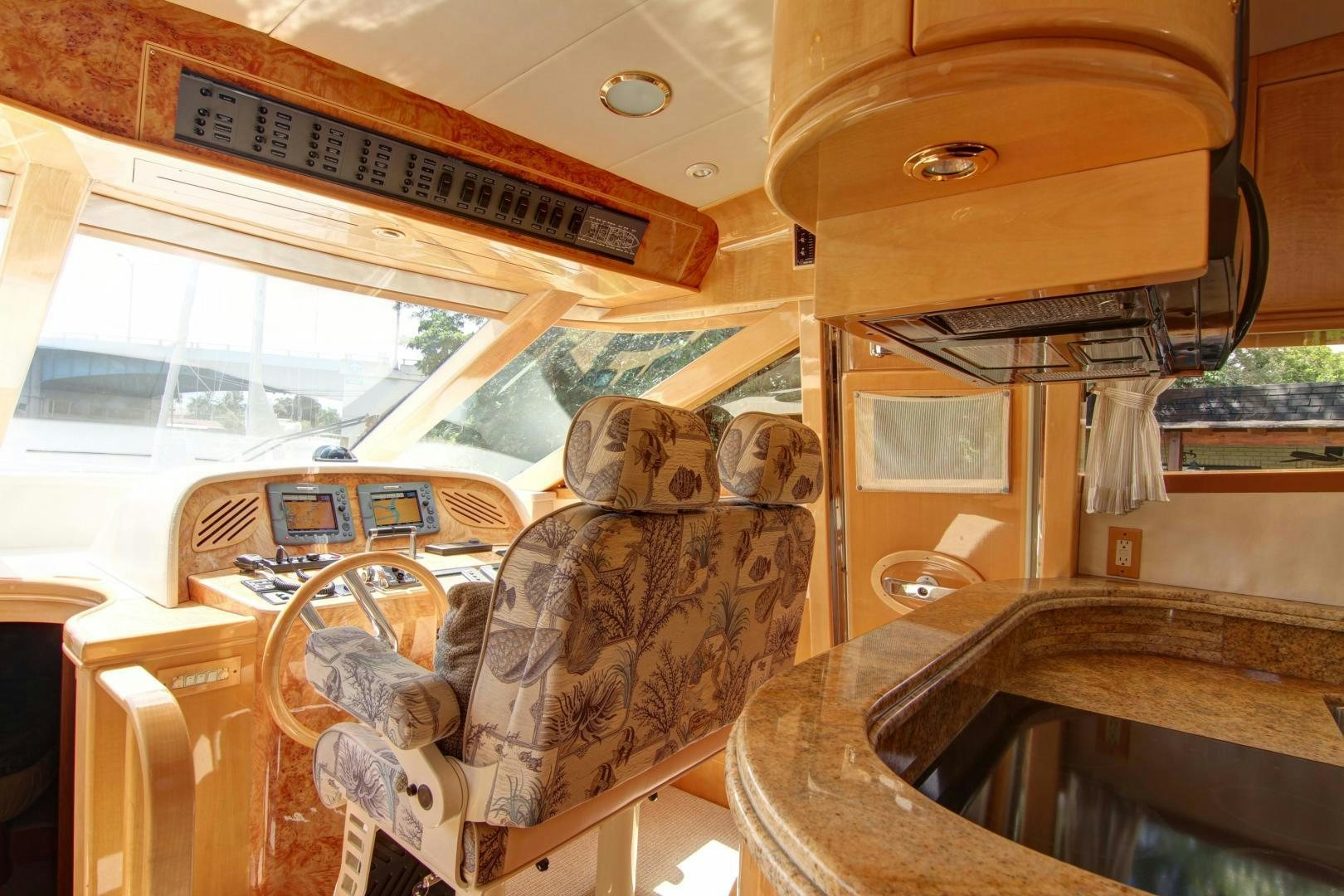 a car with a dog on the seat aboard UNSINKABLE II Yacht for Sale