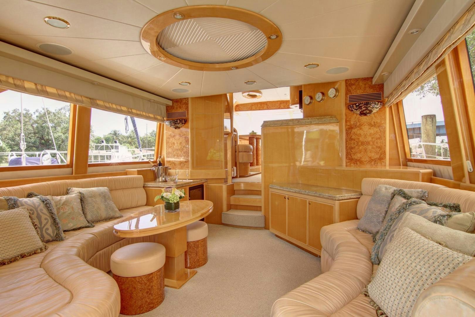 a living room with a couch and a table aboard UNSINKABLE II Yacht for Sale