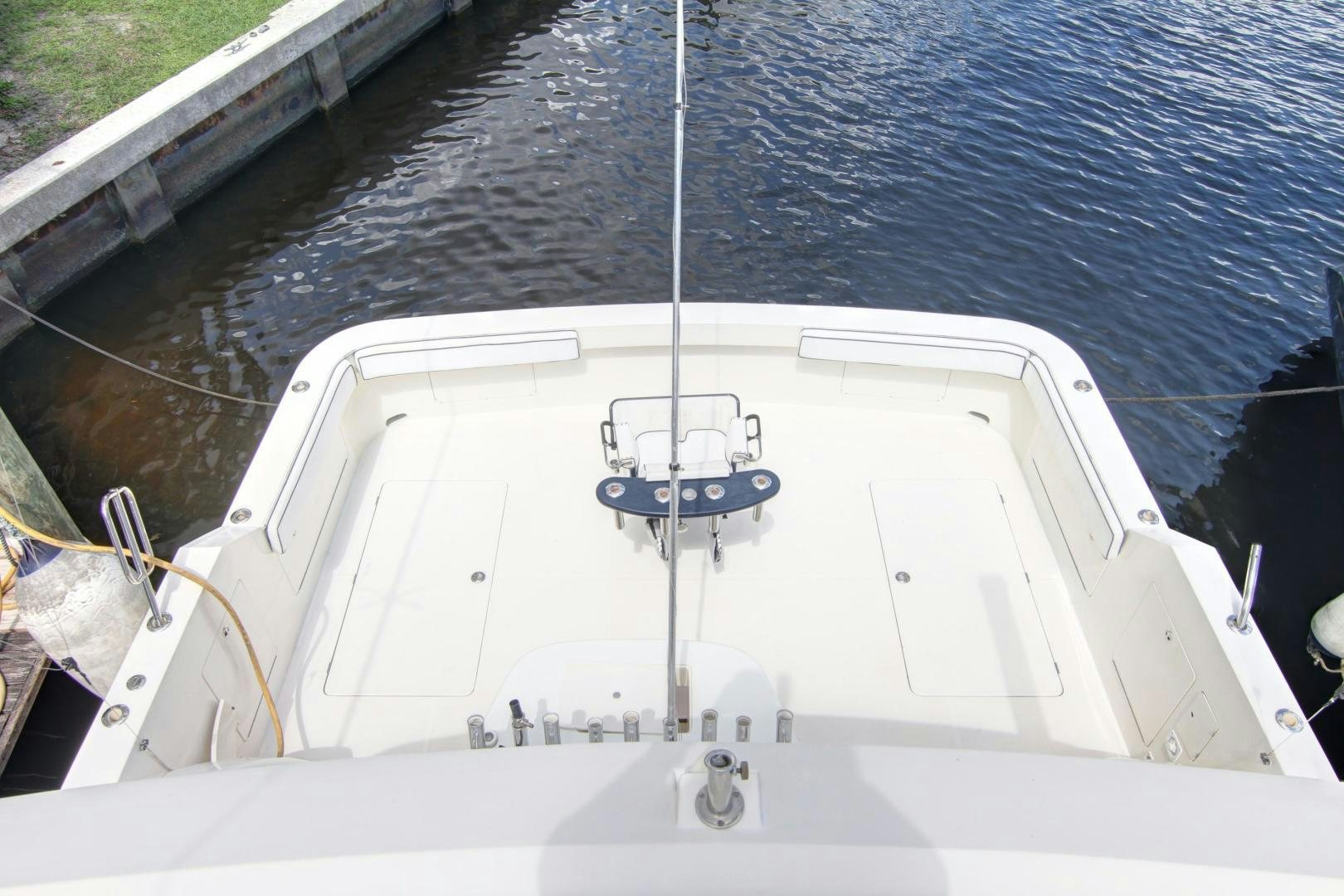 a white boat with ropes on the deck aboard UNSINKABLE II Yacht for Sale