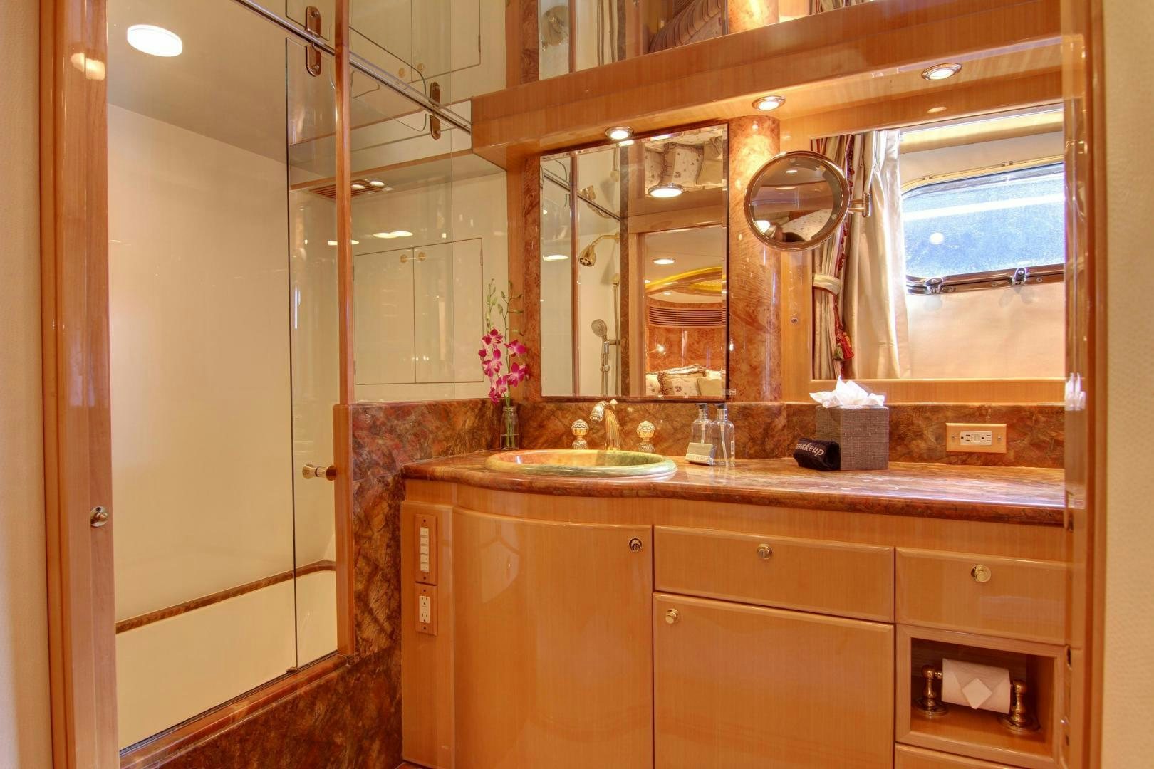 a bathroom with a large mirror aboard UNSINKABLE II Yacht for Sale