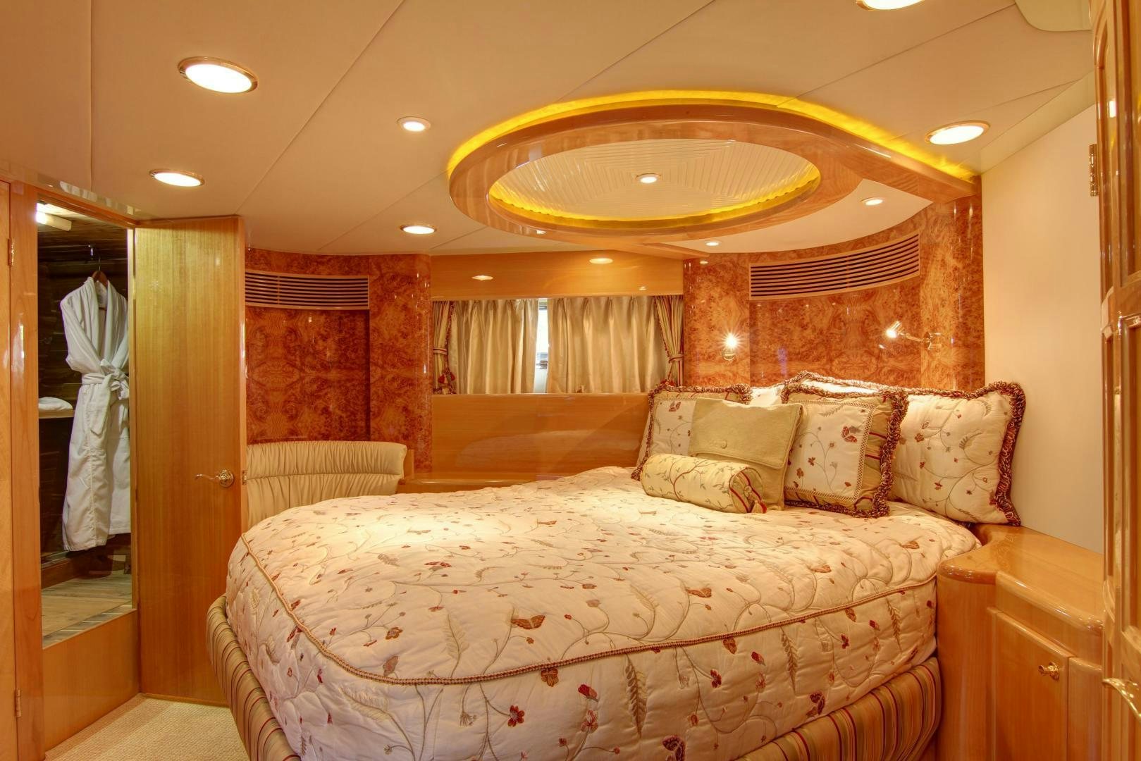 a large bed in a hotel room aboard UNSINKABLE II Yacht for Sale