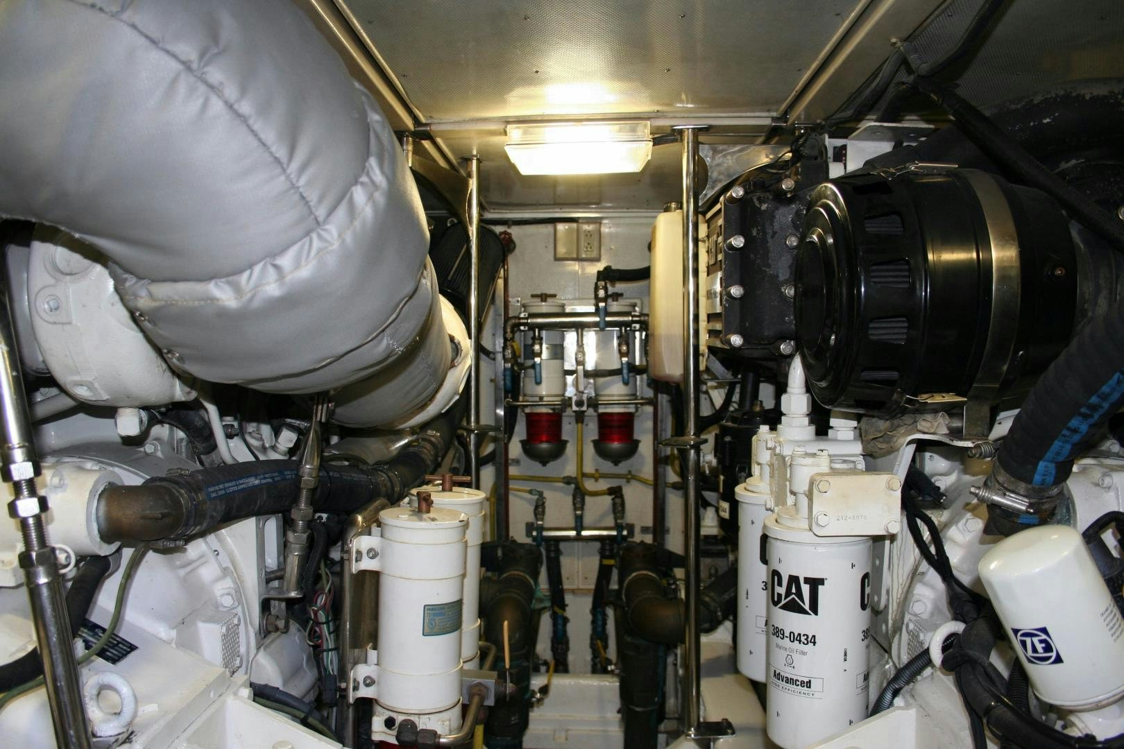 a large machine with many pipes aboard UNSINKABLE II Yacht for Sale
