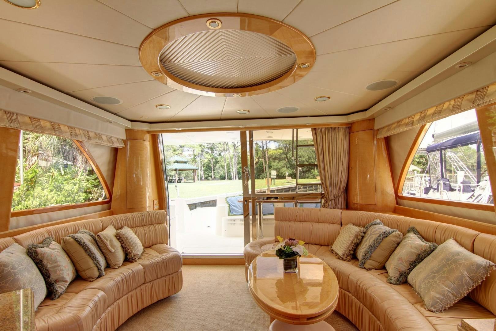 a living room with a large window aboard UNSINKABLE II Yacht for Sale