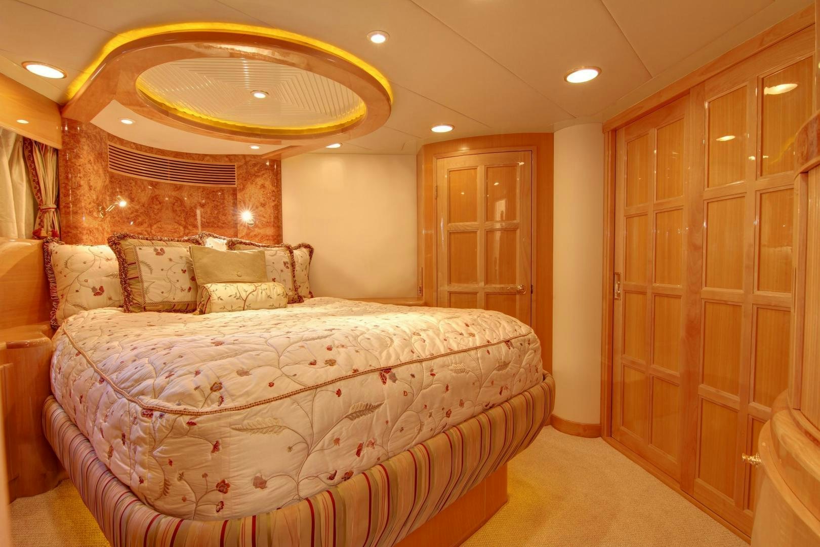 a large bedroom with a large bed aboard UNSINKABLE II Yacht for Sale
