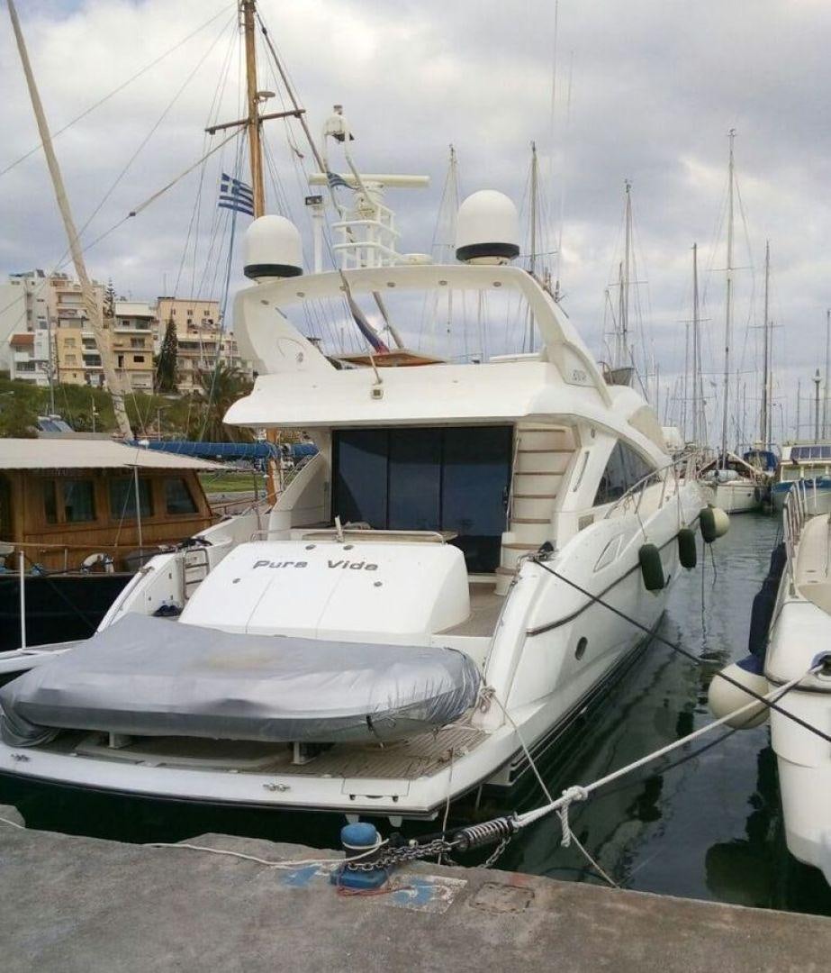 a boat docked at a pier aboard PURA VIDA Yacht for Sale