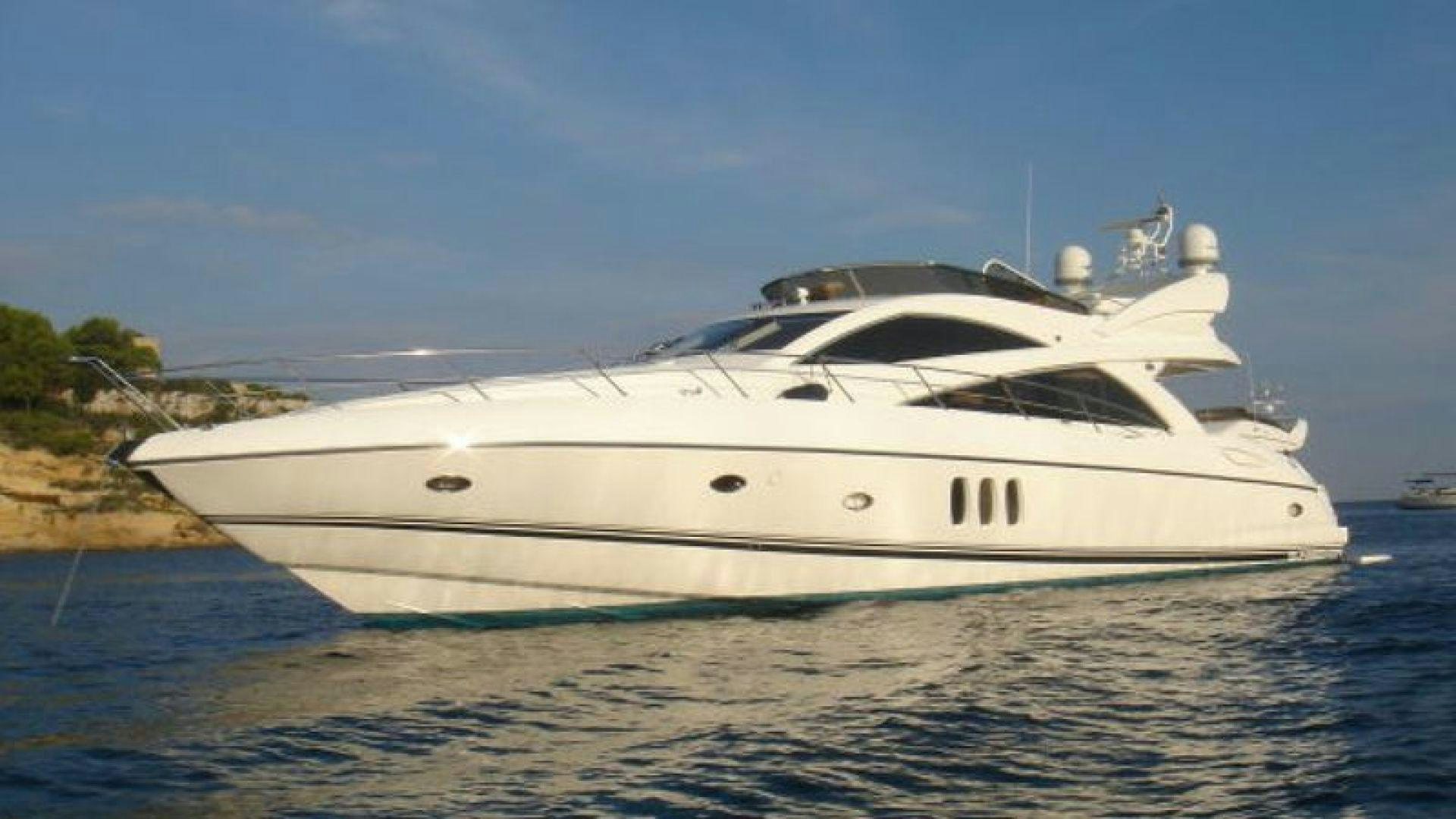 a white yacht on the water aboard PURA VIDA Yacht for Sale