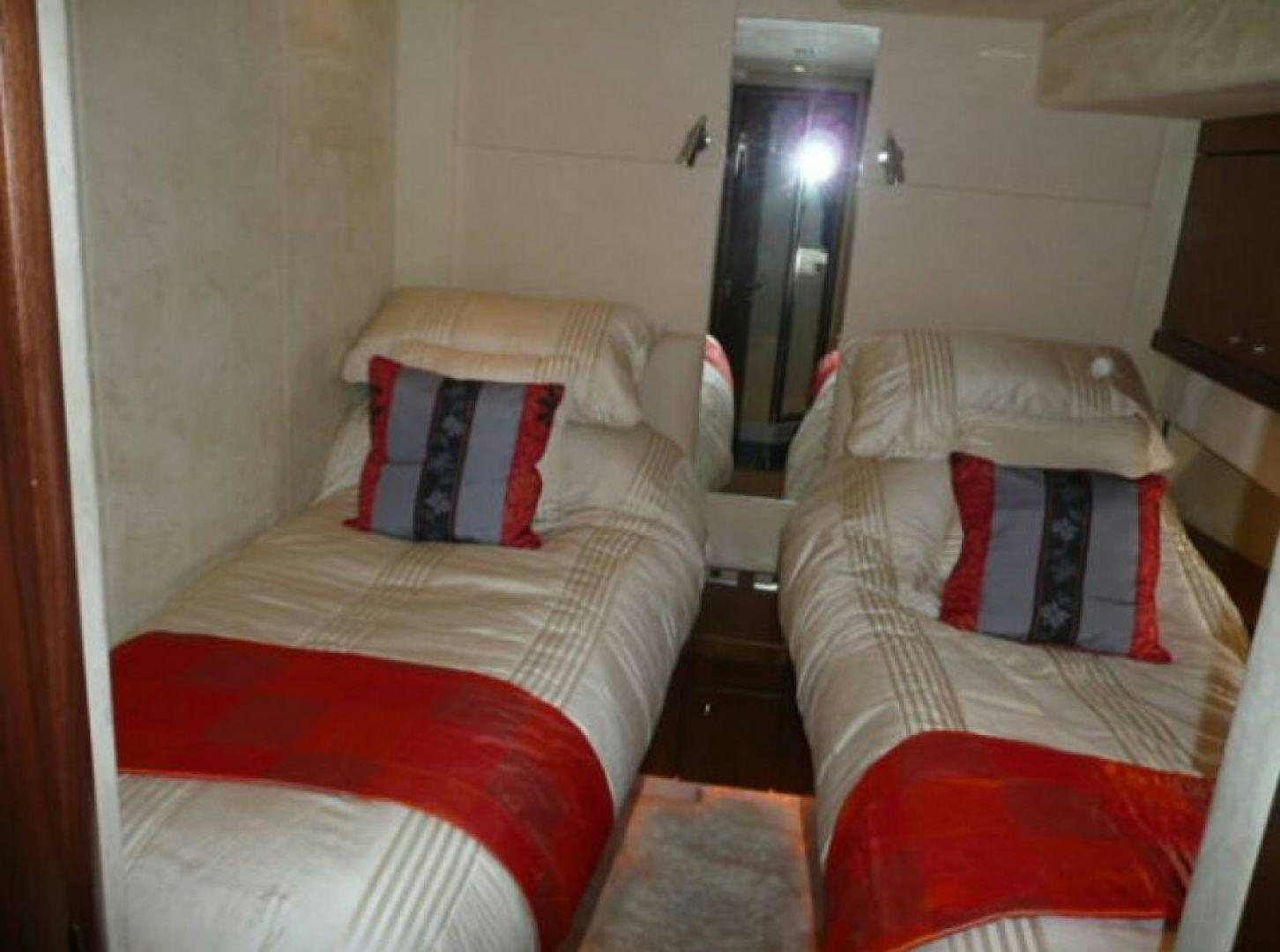a couple of beds in a room aboard PURA VIDA Yacht for Sale