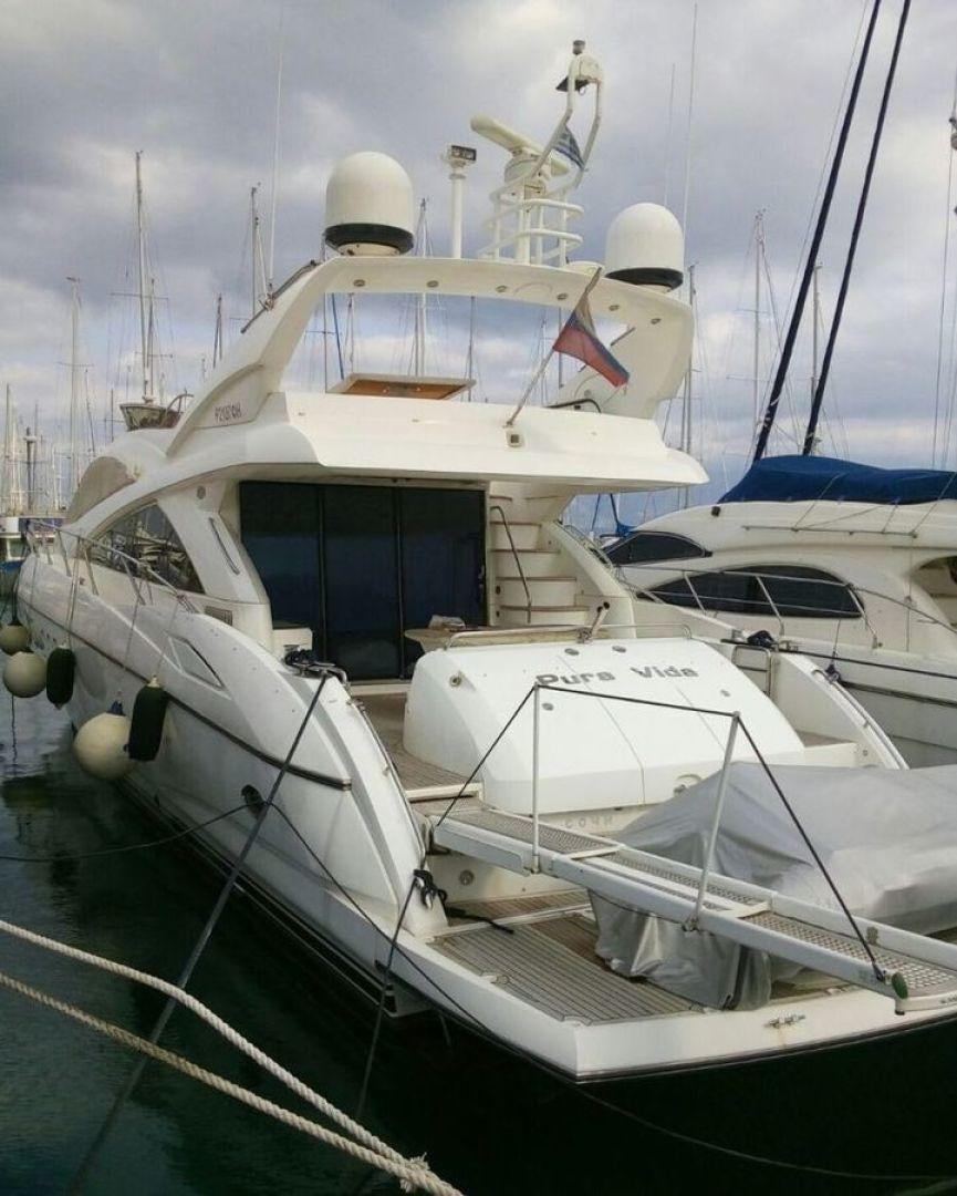 a group of boats in a harbor aboard PURA VIDA Yacht for Sale