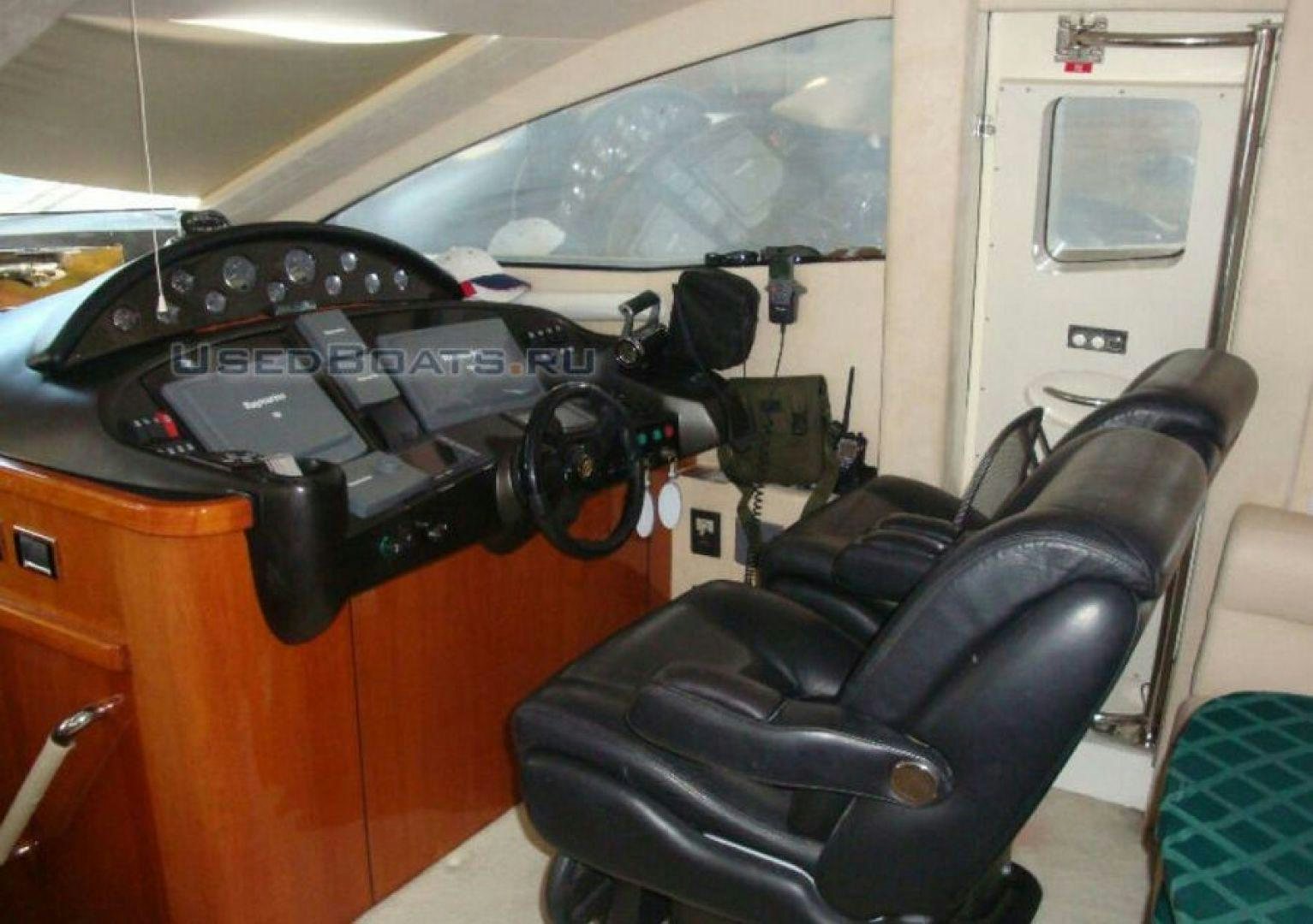 a black camera on a chair aboard PURA VIDA Yacht for Sale