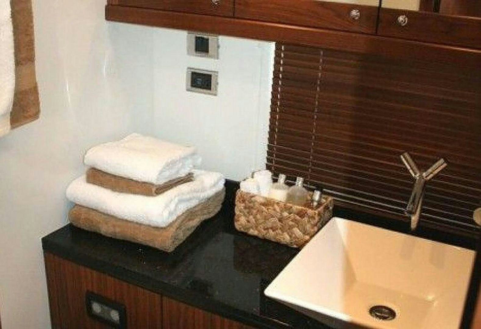 a counter with a towel and a sink aboard PURA VIDA Yacht for Sale