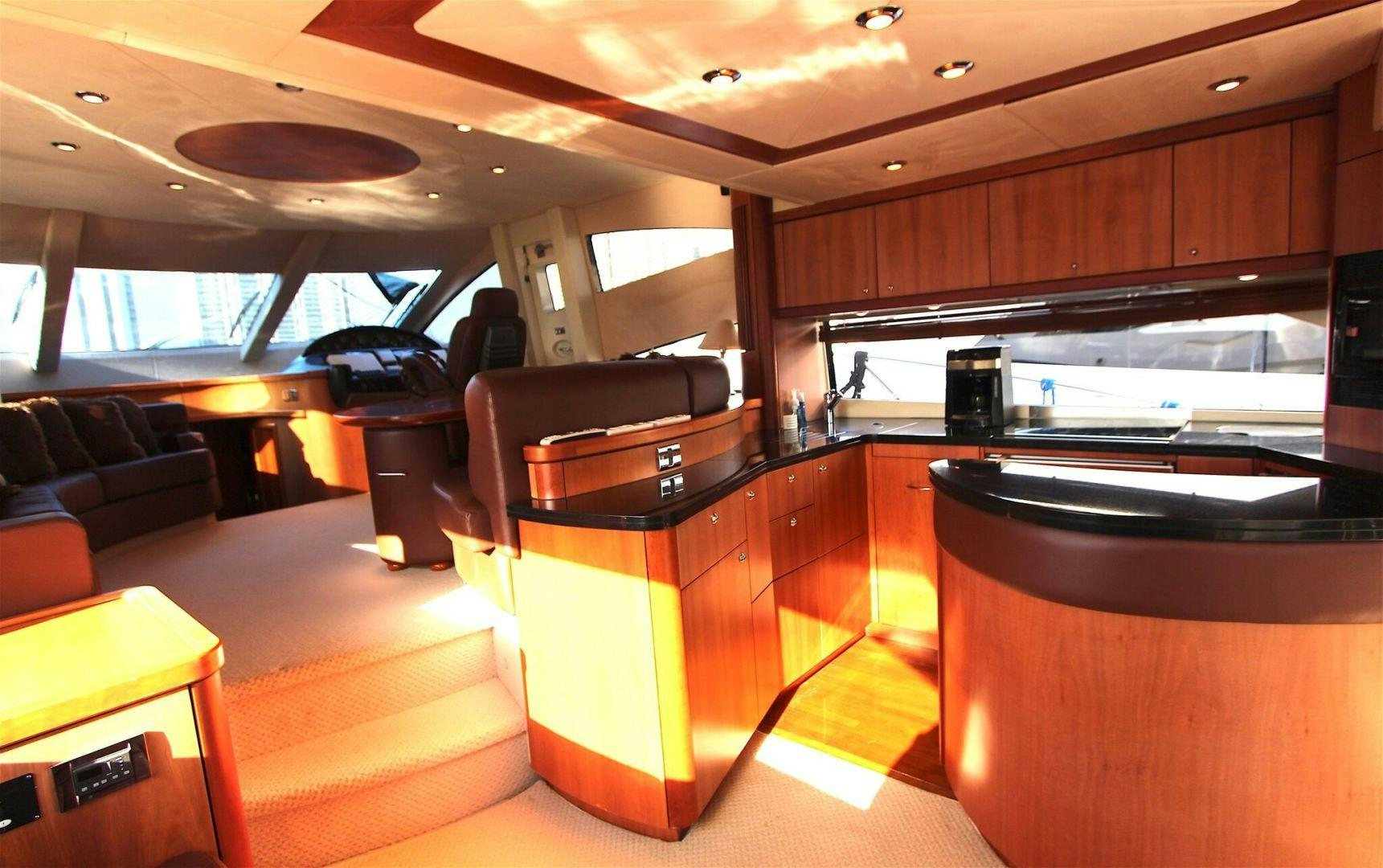 a room with a couch and a table aboard No Name Yacht for Sale