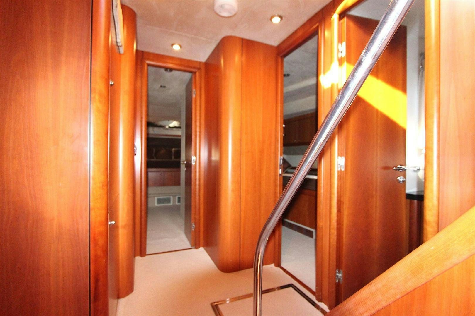 a hallway with wooden doors aboard No Name Yacht for Sale