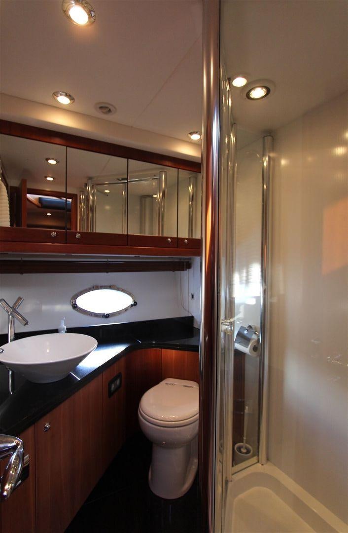 a bathroom with a sink and toilet aboard No Name Yacht for Sale