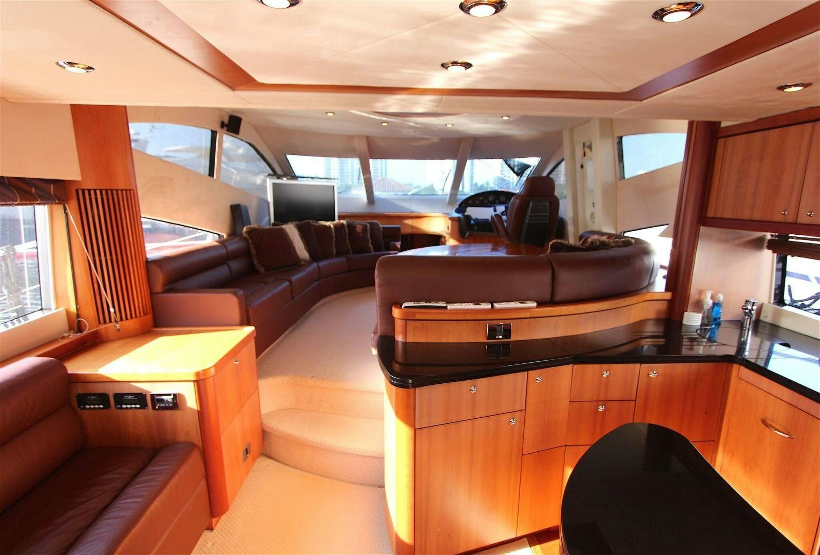 a living room with a leather couch aboard No Name Yacht for Sale