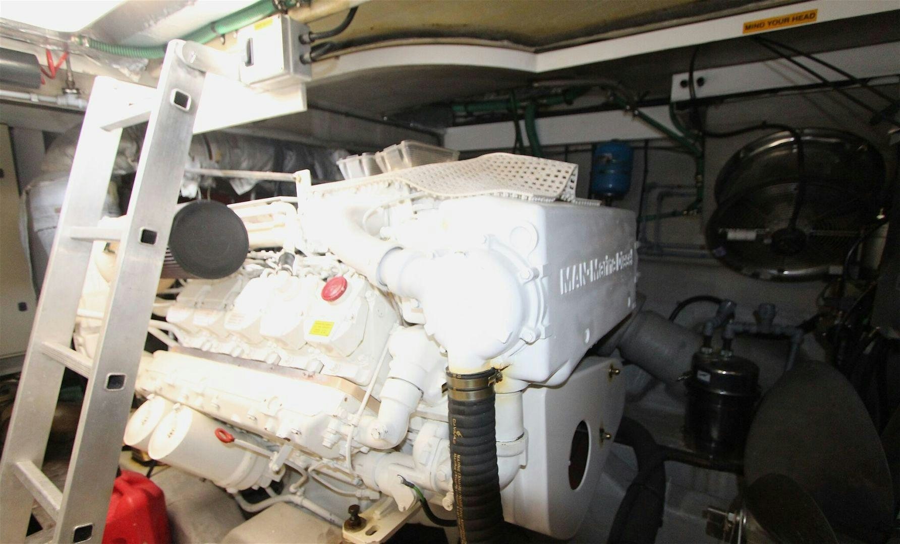 a white machine with a large white object on top aboard No Name Yacht for Sale