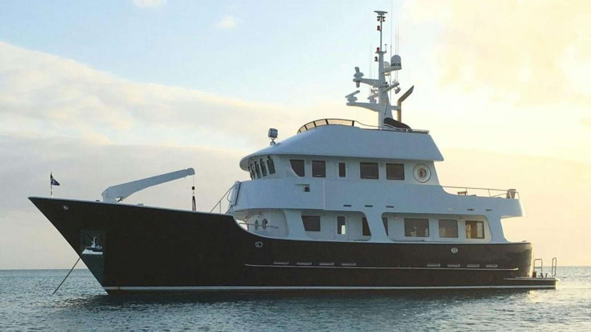 a large ship in the water aboard HERCULES Yacht for Sale