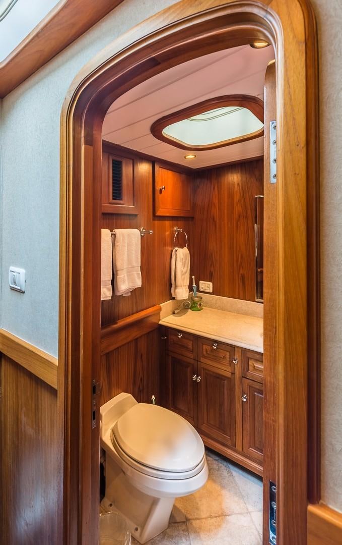 a bathroom with a toilet and a sink aboard HERCULES Yacht for Sale