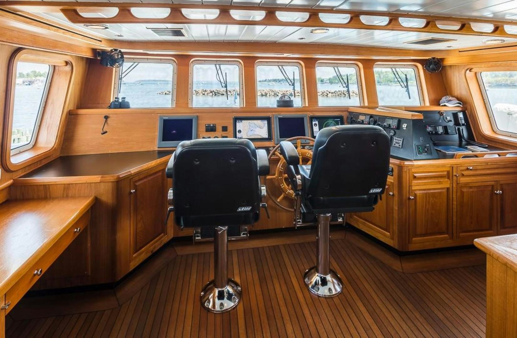 a room with a desk and chairs aboard HERCULES Yacht for Sale