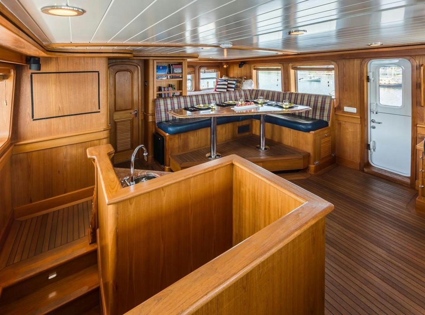 a kitchen with wooden cabinets aboard HERCULES Yacht for Sale
