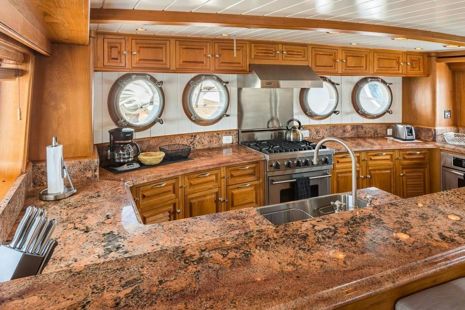 a kitchen with a granite counter top aboard HERCULES Yacht for Sale
