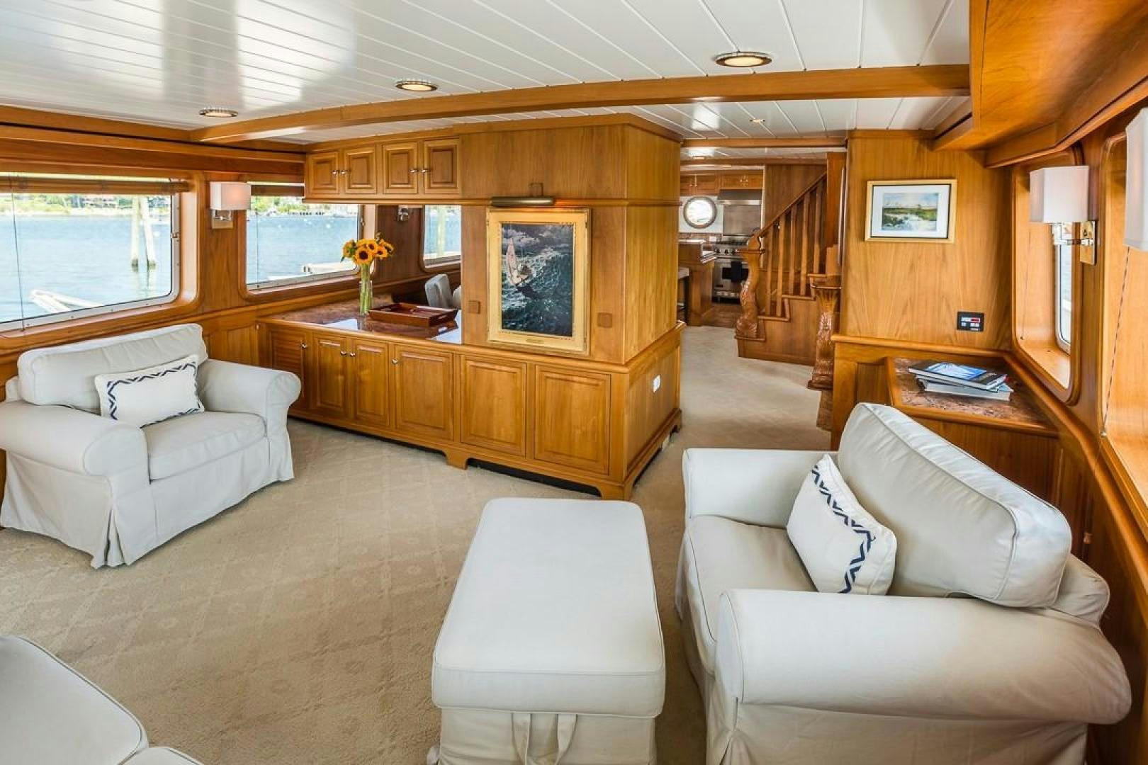 a living room with a couch and a table aboard HERCULES Yacht for Sale
