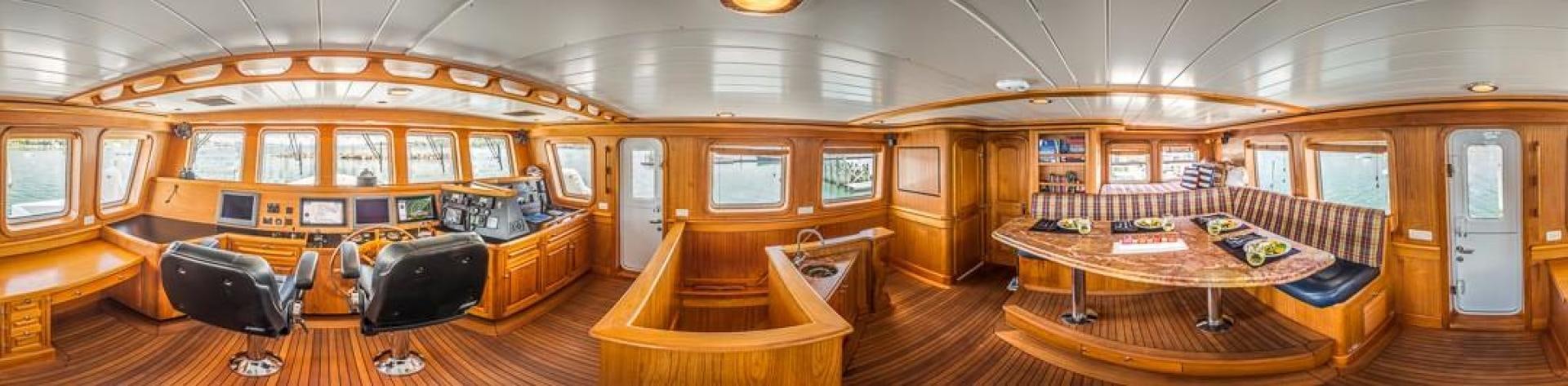 a room with a table and chairs aboard HERCULES Yacht for Sale