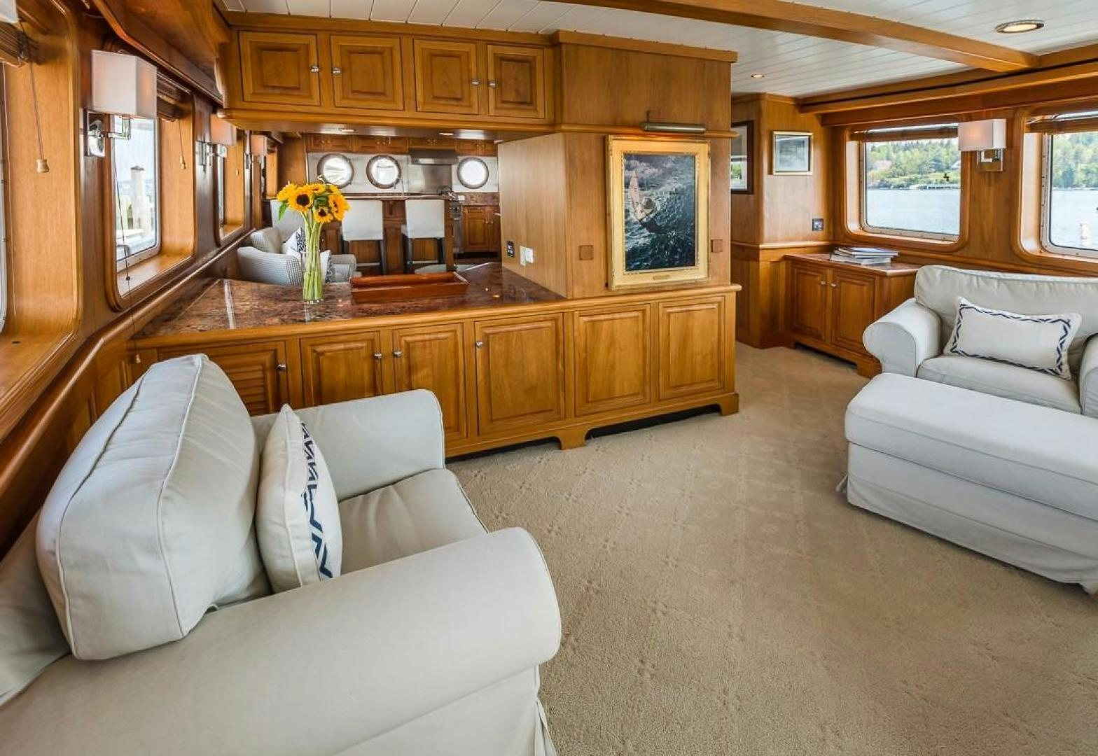 a living room with a couch and a fireplace aboard HERCULES Yacht for Sale