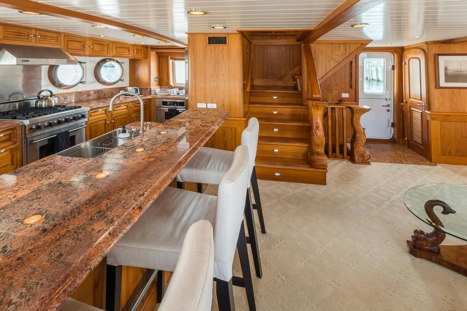 a kitchen with a large island aboard HERCULES Yacht for Sale