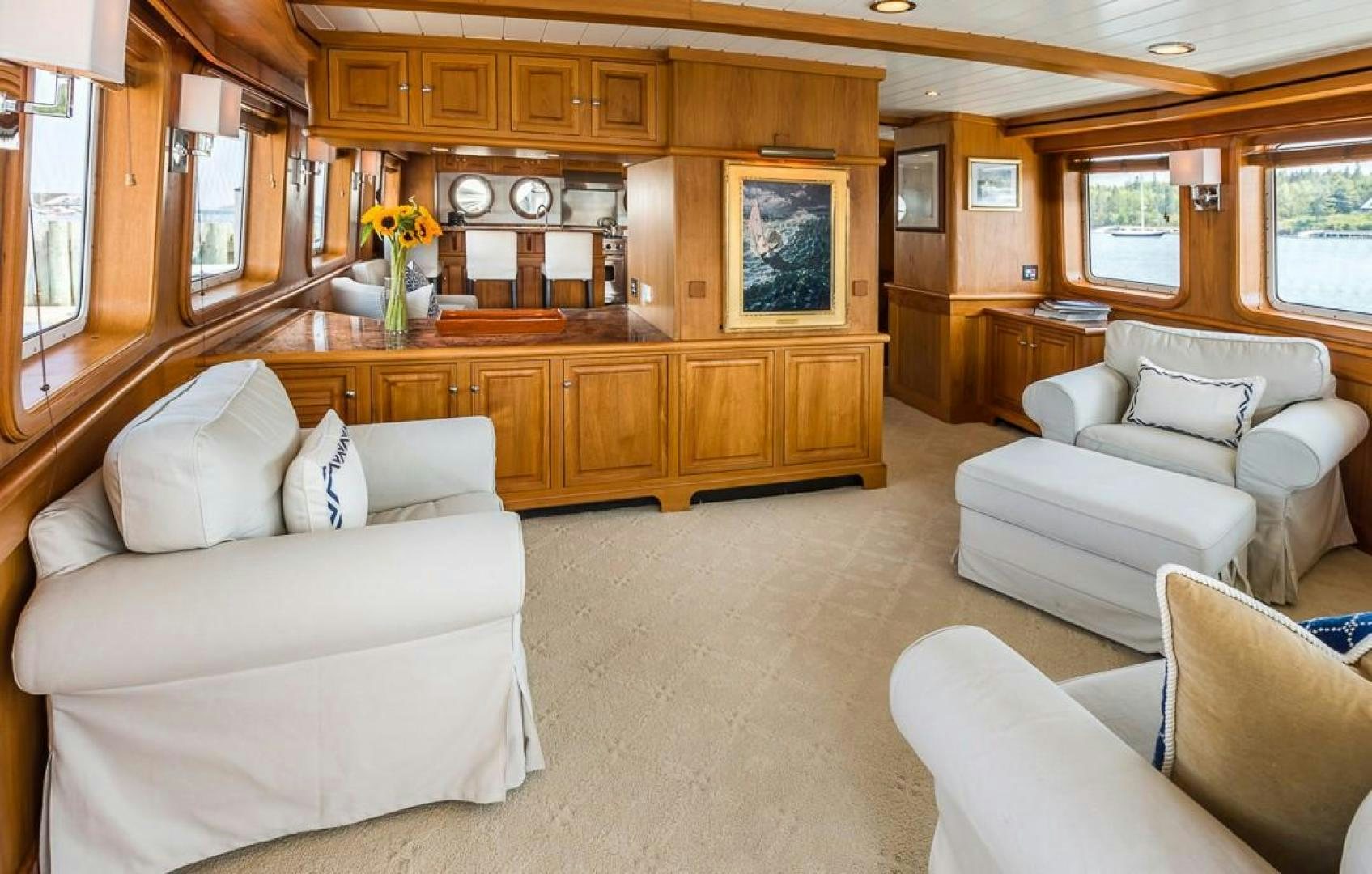 a living room with a couch and a coffee table aboard HERCULES Yacht for Sale