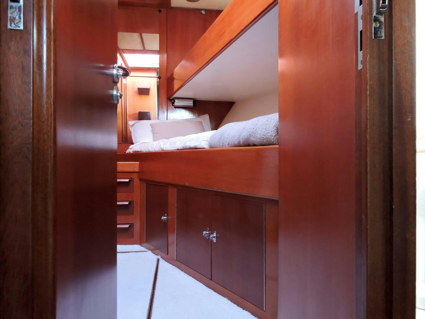 a bed in a room aboard WHITE GARUDA Yacht for Sale