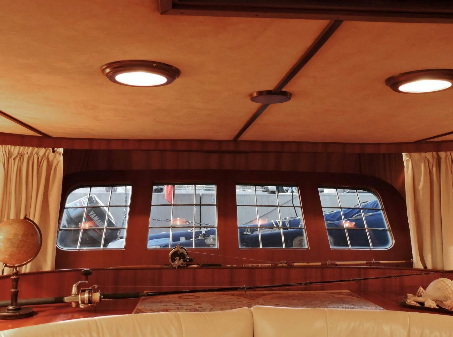 a room with a large window and a wood floor aboard WHITE GARUDA Yacht for Sale