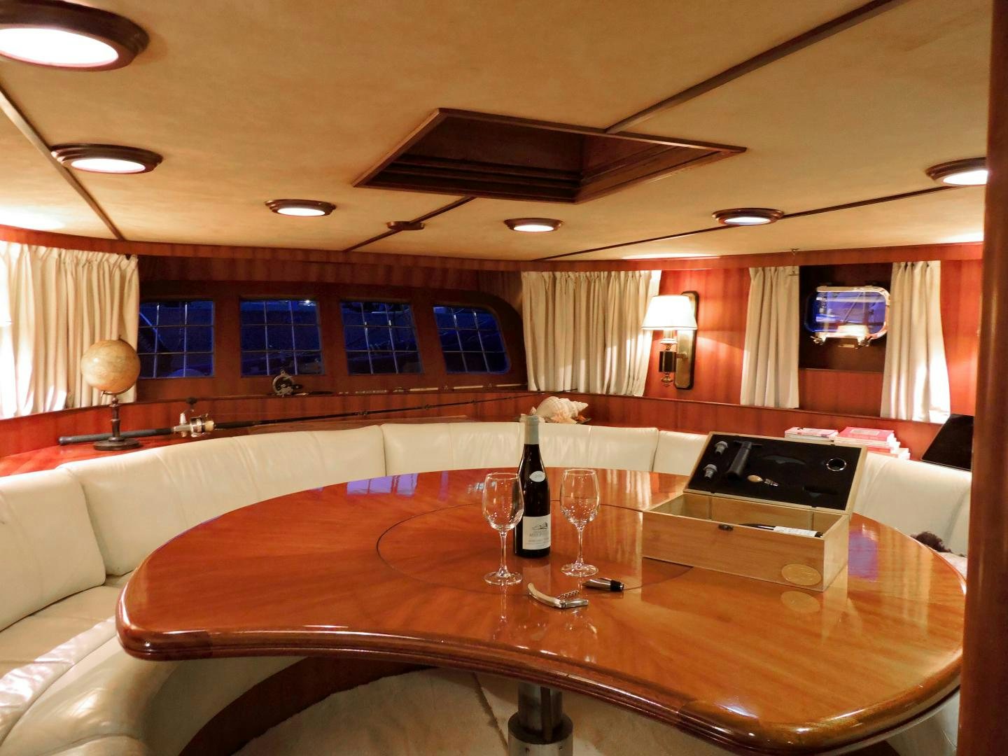 a large room with a table and wine glasses aboard WHITE GARUDA Yacht for Sale