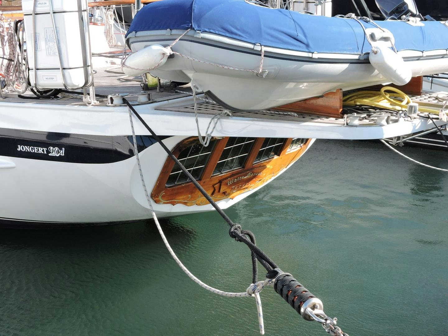 a boat tied to a dock aboard WHITE GARUDA Yacht for Sale