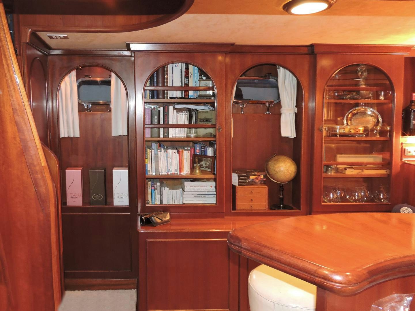 a room with a bookcase and a mirror aboard WHITE GARUDA Yacht for Sale