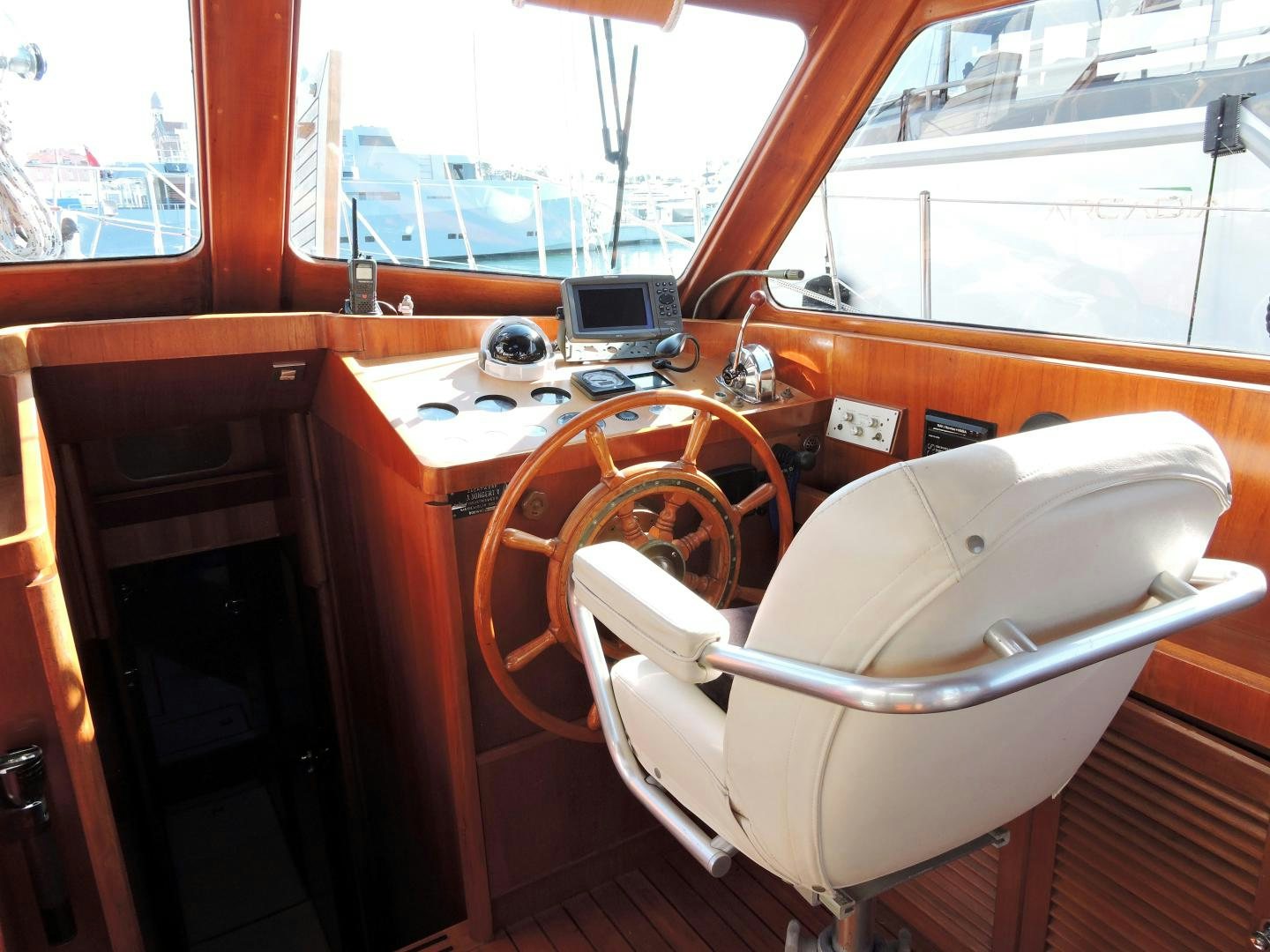 a boat with a seat and a desk in the front aboard WHITE GARUDA Yacht for Sale