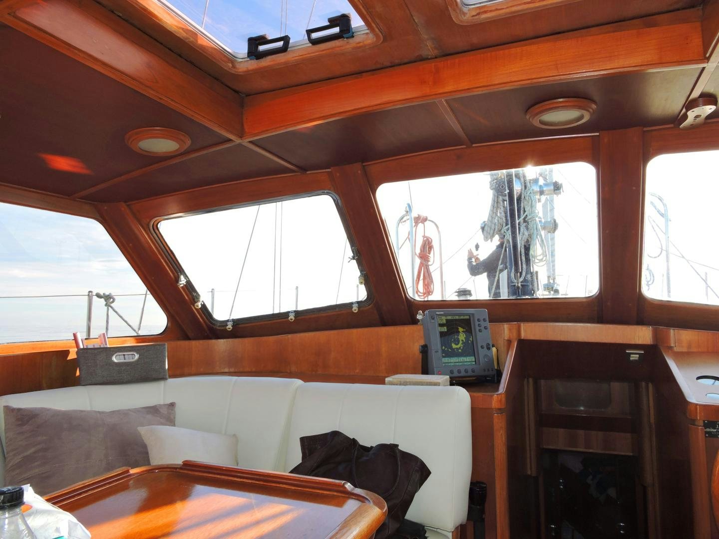 a room with a couch and a television aboard WHITE GARUDA Yacht for Sale