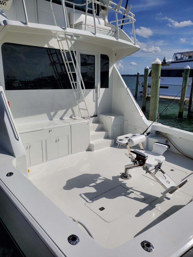a white boat with a deck aboard No Name Yacht for Sale