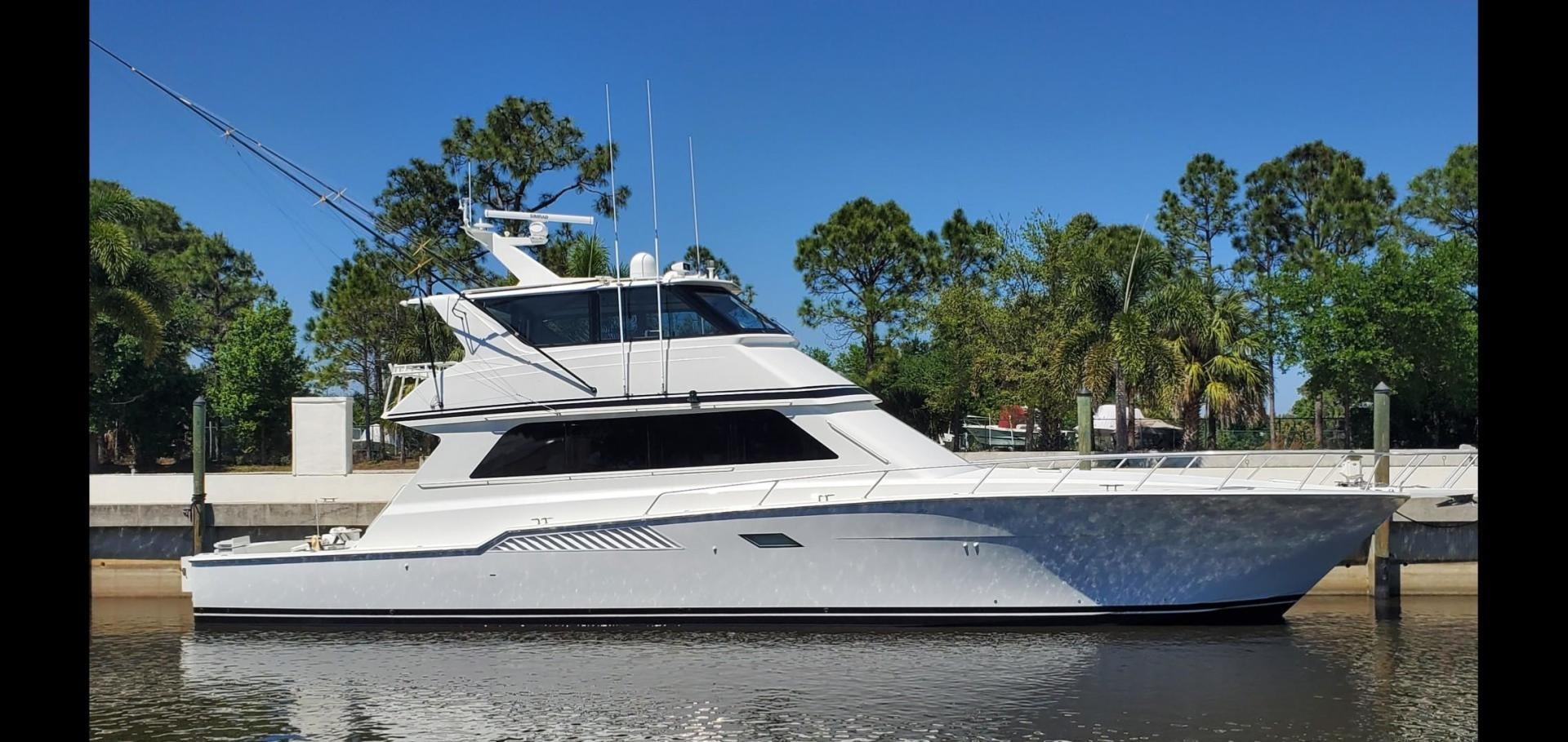 a white boat on a body of water aboard No Name Yacht for Sale