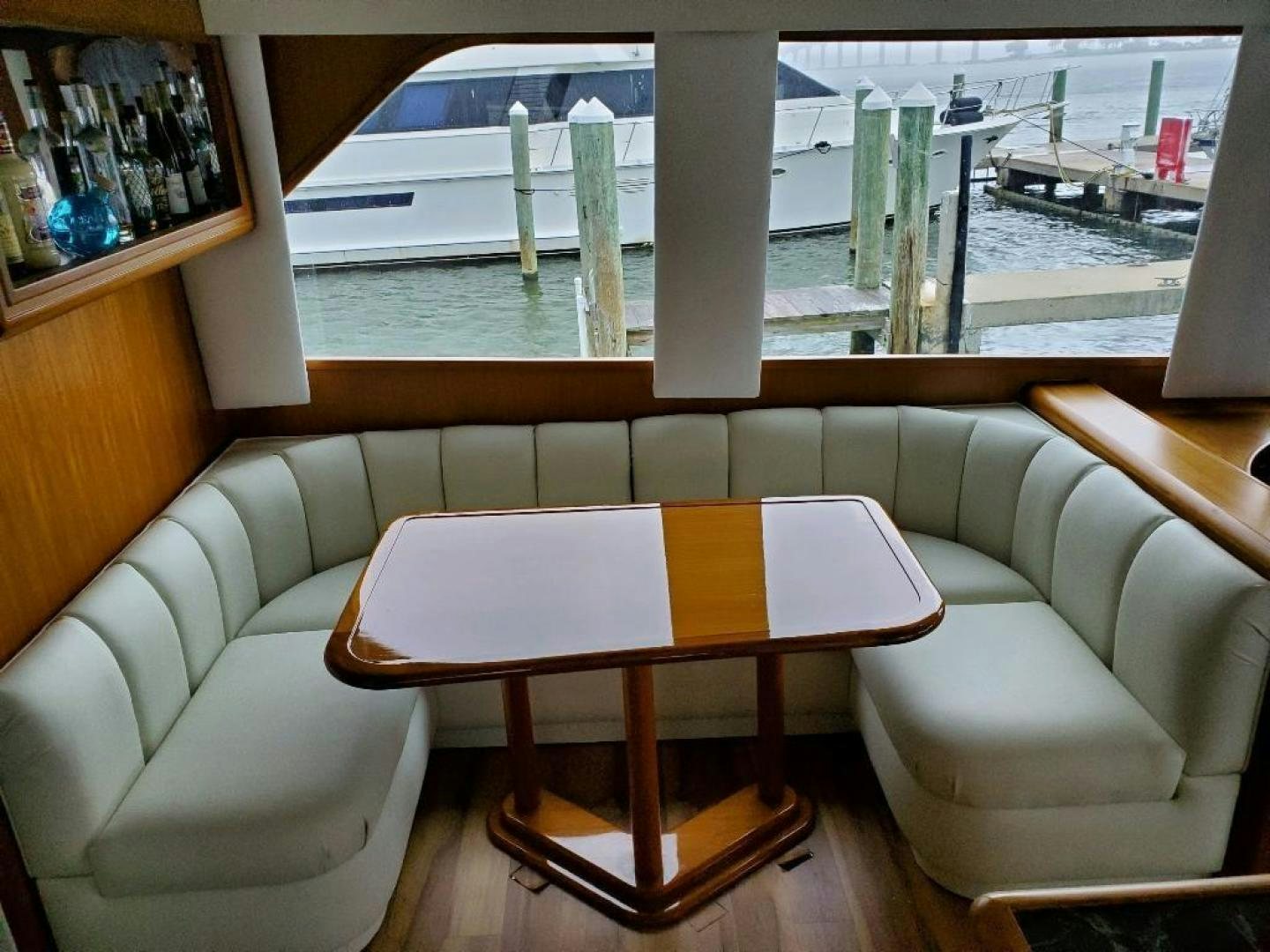 a table and chairs in a room aboard No Name Yacht for Sale