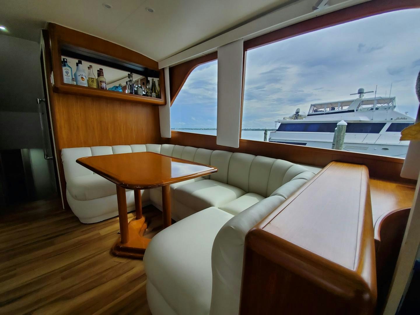 a living room with a large window aboard No Name Yacht for Sale