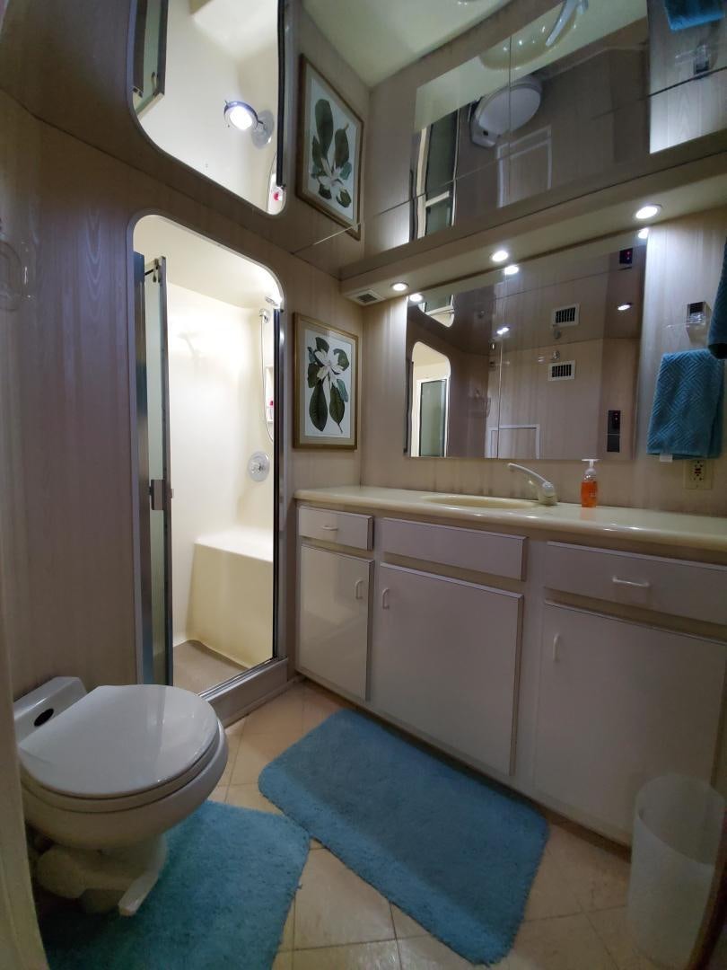 a bathroom with a toilet and a sink aboard No Name Yacht for Sale