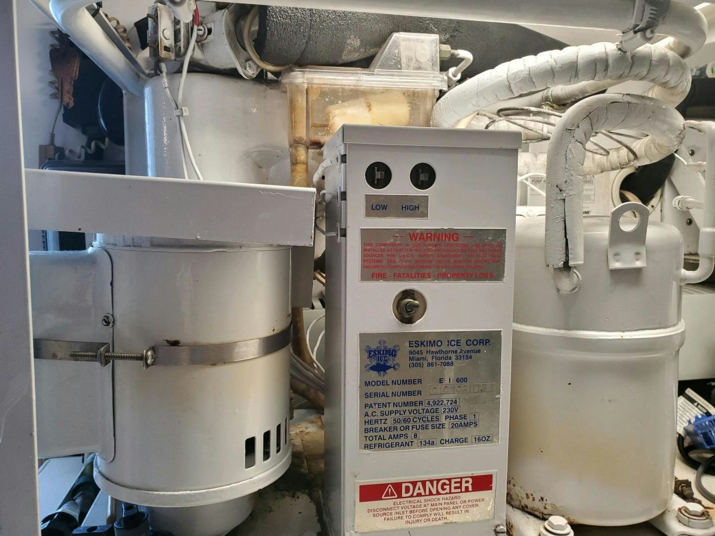 several white machines in a room aboard No Name Yacht for Sale