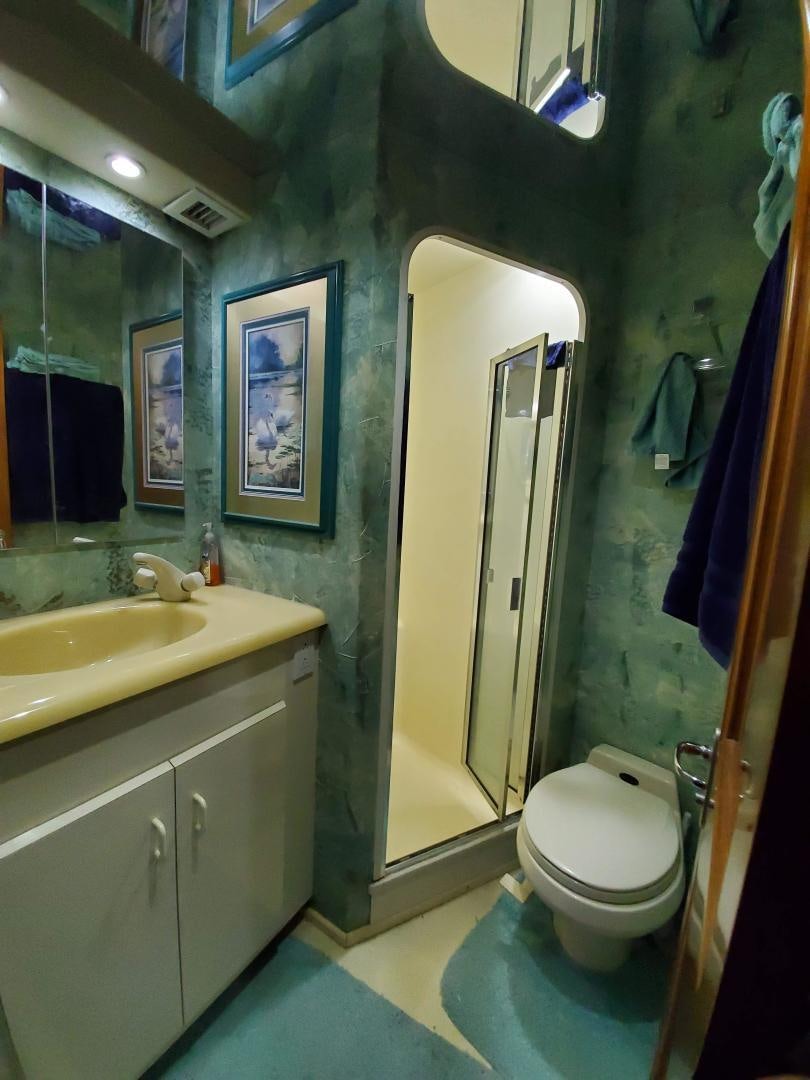 a bathroom with a toilet and a sink aboard No Name Yacht for Sale